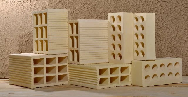 What is the difference between clay brick and normal brick?